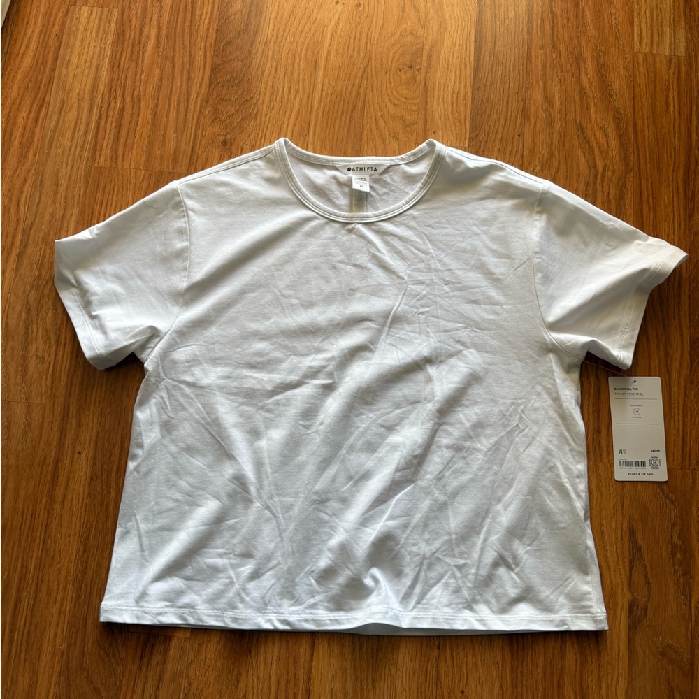 Athleta women’s Essential tee. Sz Medium. White Short Sleeve. New with tags!